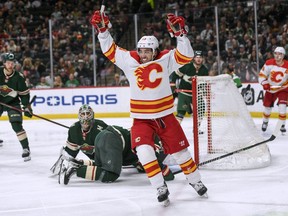 Calgary Flames forward Johnny Gaudreau celebrates after scoring his 40th goal of the season during a game against the Minnesota Wild at Xcel Energy Center in St. Paul, Minn., on Thursday, April 28, 2022.