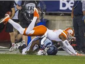 Toronto Argonauts Andre Durie and BC Lions Ryan Phillips during 2nd half CFL action at BMO Field in Toronto, Ont. on Wednesday August 31, 2016.