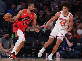 Apr 10, 2022; New York, New York, USA; Toronto Raptors center Khem Birch dribbles as New York Knicks forward Jericho Sims defends during the second half at Madison Square Garden.