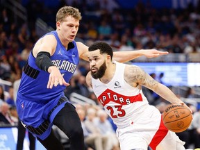 Toronto Raptors guard Fred VanVleet moves to the basket against Orlando Magic center Moritz Wagner in the first quarter at Amway Center.