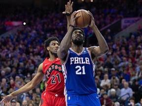 Apr 25, 2022; Philadelphia, Pennsylvania, USA; Philadelphia 76ers center Joel Embiid moves to the basket ahead of Toronto Raptors forward Thaddeus Young during the fourth quarter in game five of the first round for the 2022 NBA playoffs at Wells Fargo Center.