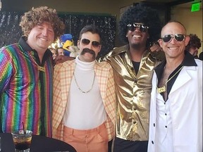 Charity event where black DJ, third from left, was accused by diversity advocates of wearing blackface.