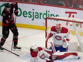Montreal Canadiens goalie Carey Prices makes a save as Ottawa Senators right-wing Drake Batherson looks on in the third period at the Canadian Tire Centre on April 23, 2022.