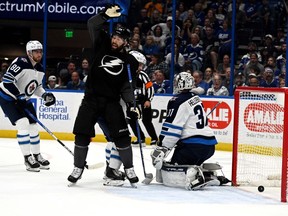 Tampa Bay Lightning left wing Patrick Maroon (14) celebrates a goal in the first period against the Winnipeg Jets at Amalie Arena in Tampa, Fla., on Saturday, April 16, 2022.