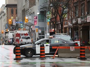 A police blockade at the intersection of Wellington and Bank streets during the 'Freedom Convoy' protest in Ottawa in February. Ottawa police have said there will be a 'motor vehicle exclusion zone' because of the planned Rolling Thunder Ottawa rally in Ottawa starting later this week.