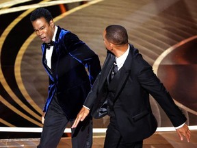 Will Smith slaps Chris Rock during the Oscars at the Dolby Theater in Hollywood, Calif., March 27, 2022.