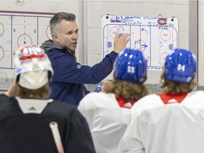 Interim head coach Martin St. Louis talks strategy during practice at the Bell Sports Complex in Brossard on April 25, 2022. St. Louis turned the struggling Cole Caufield around, Jack Todd writes.