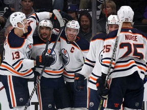 Evander Kane #91 of the Edmonton Oilers celebrates his goal with eo13#@, Connor McDavid #97, Cody Ceci #5 and Darnell Nurse #25 of the Edmonton Oilers, to take a 3-0 lead over the Los Angeles Kings during the second period in Game Three of the First Round of the 2022 Stanley Cup Playoffs at Crypto.com Arena on May 06, 2022 in Los Angeles, California.