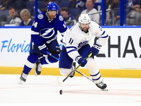 Colin Blackwell of the Toronto Maple Leafs looks to pass in the third period during Game Five of the First Round of the 2022 Stanley Cup Playoffs against the Tampa Bay Lightning at Amalie Arena on May 12, 2022 in Tampa, Florida.