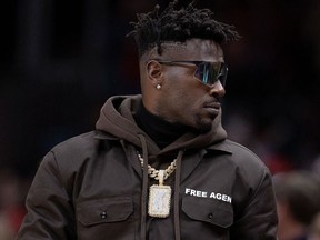 NFL player Antonio Brown looks on during the second half of the game between the Atlanta Hawks and the Los Angeles Clippers at State Farm Arena on March 11, 2022 in Atlanta, Ga.