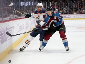 Connor McDavid and the Edmonton Oilers fights for the puck against Nathan MacKinnon of the Colorado Avalanche during a regular season game. The two teams kick off their Western Conference final tonight.