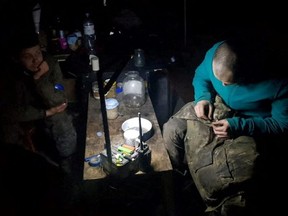 Service members of Mariupol's unit of the Ukrainian Sea Guard stay inside a bunker of the Azovstal Iron and Steel Works, amid Russia's invasion of Ukraine, in Mariupol, Ukraine in this handout picture released on May 15, 2022.