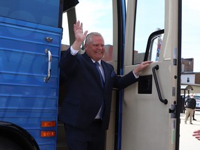 Ontario PC party leader Doug Ford waves from his bus as he arrives at the Federation of Northern Ontario Municipalities debate held at the Capitol Centre in North Bay, Ont. on Tuesday, May 10,2022.