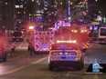 This photo taken from video provided by WISN 12 News shows police responding to the scene of a shooting at Water Street and Juneau Avenue in Milwaukee, Friday, May 13, 2022.