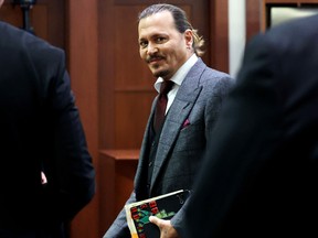 Johnny Depp seen smiling in a Virginia courtroom.