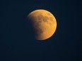 Super-blood moon rises over the Dragoon Mountains as viewed from Tombstone, Arizona