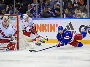 New York Rangers centre Filip Chytil takes a shot while diving around the side of the net against the Carolina Hurricanes during the third period in game four of the second round of the 2022 Stanley Cup Playoffs at Madison Square Garden in New York, May 23, 2022.