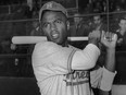 Jackie Robinson holds a bat in his Montreal Royals uniform, the Brooklyn Dodgers farm team, circa 1946.