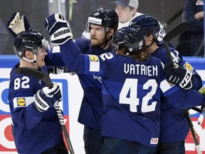 Finland's Joel Armia, centre, celebrates scoring a goal with Miro Heiskanen, Sami Vatanen and Harri Pesonen against the United States at the IIHF World Ice Hockey Championship in Tampere, Finland, Saturday, May 28, 2022.