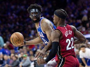 Philadelphia 76ers centre Joel Embiid controls the ball against Miami Heat forward Jimmy Butler during the third quarter in game three of the second round for the 2022 NBA playoffs at Wells Fargo Center in Philadelphia, May 6, 2022.