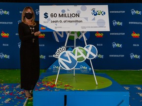 Leah Murdoch-Gerics, of Hamilton, with her $60-million cheque.