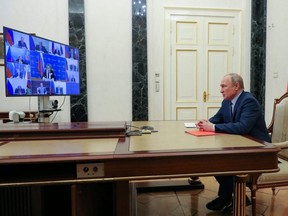 Russian President Vladimir Putin chairs a meeting with members of the Security Council in Moscow, Friday, April 22, 2022.