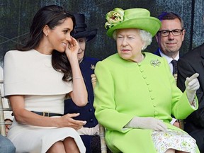 Britain's Queen Elizabeth and Meghan, The Duchess Of Sussex, attend the opening of the Mersey Gateway Bridge in Runcorn, England, June 14, 2018.