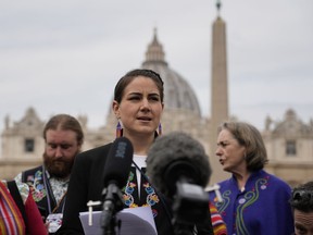 Cassidy Caron speaks to the media in St. Peter's Square after a meeting with Pope Francis at the Vatican on Monday, March 28, 2022.