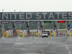 A car heads to the U.S. border crossing, Monday, August 9, 2021 in Lacolle, Que., south of Montreal.