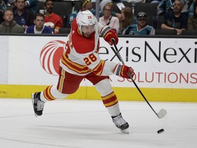 Calgary Flames centre Elias Lindholm, pictured firing a goal-scoring shot against the San Jose Sharks on April 7, 2022, has reached the 40-goal mark this season.