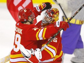 Calgary Flames goaltender Jacob Markstrom is congratulated by Matthew Tkachuk after shutting out the Detroit Red Wings at the Scotiabank Saddledome in Calgary on Saturday, March 12, 2022.