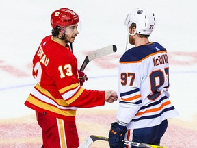 Flames forward Johnny Gaudreau shakes hands with Edmonton Oilers centre Connor McDavid at the end of Game 5 on Thursday.