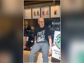 Actor James Cromwell is pictured at a Starbucks after supergluing his hand on the counter during a protest.
