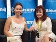 Actress Ashley Judd, left, and mother, singer Naomi Judd pose following the launch of Naomi's SiriusXM series "Think Twice" at SiriusXM Music City Theater at the Bridgestone Arena on June 5, 2012 in Nashville, Tennessee.