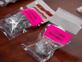 Evidence bags containing fentanyl are displayed during a news conference at Surrey RCMP Headquarters, in Surrey, B.C., on Thursday, Sept. 3, 2020.