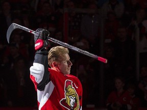 File photo/ Daniel Alfredsson salutes the crowd after skating with the Ottawa Senators one last time in Ottawa on Thursday December 4, 2014.