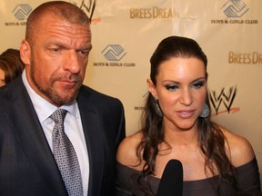 Stephanie McMahon, the WWE's Chief Brand Officer, is seen with her husband, WWE COO Triple H, in New Orleans ahead of Wrestlemania XXX, April 3, 2014.
