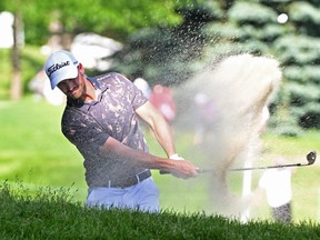Wyndham Clark hits a bunker shot at the 15th hole during the second round of the RBC Canadian Open golf tournament.