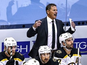 Head coach Bruce Cassidy of the Boston Bruins reacts against the Tampa Bay Lightning during the first overtime period in Game Five of the Eastern Conference Second Round during the 2020 NHL Stanley Cup Playoffs at Scotiabank Arena on August 31, 2020 in Toronto, Ontario.