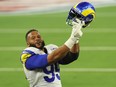 Aaron Donald of the Los Angeles Rams reacts following a fourth down stop during the fourth quarter of Super Bowl LVI against the Cincinnati Bengals at SoFi Stadium on February 13, 2022 in Inglewood, California.