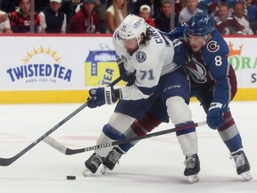 Anthony Cirelli of the Tampa Bay Lightning and Cale Makar of the Colorado Avalanche battle for the puck during the second period in Game Five of the 2022 NHL Stanley Cup Final at Ball Arena on June 24, 2022 in Denver, Colorado.