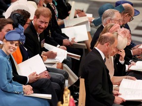 Prince Harry (centre), Duke of Sussex, grimaces as he waits for the start of the National Service of Thanksgiving for The Queen's reign at Saint Paul's Cathedral in London on June 3, 2022 as part of Queen Elizabeth II's platinum jubilee celebrations.