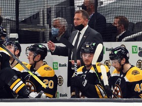 Head coach Bruce Cassidy of the Boston Bruins handles the bench during the Stanley Cup playoffs at the TD Garden on May 31, 2021 in Boston.