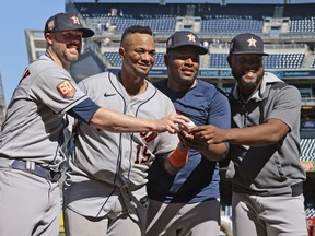 Ryan Pressly, Martin Maldonado, Cristian Javier of the Houston Astros and Hector Neris of the Houston Astros pose for a photo after pitching a combined no hitter against the New York Yankees at Yankee Stadium on June 25, 2022 in the Bronx borough of New York City.