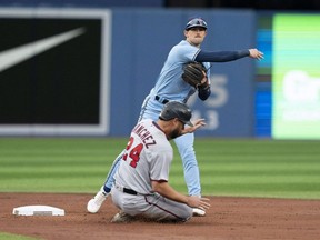 Twins catcher Gary Sanchez (24) is tagged out by Blue Jays second baseman Cavan Biggio during first inning MLB action at Rogers Centre in Toronto, Friday, June 3, 2022.