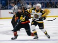 Saint John Sea Dogs and Mason McTavish (23) of the Hamilton Bulldogs battle at the 2022 Memorial Cup at Harbour Station arena in Saint John, NB.