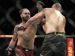 Glover Teixeira (right) fights Jiri Prochazka in their men's light heavyweight title match during the UFC 275 event in Singapore on June 12, 2022.