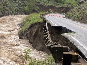 High water levels in the Gardner River erode Yellowstone National Park's North Entrance Road, where the park was closed due to heavy flooding, rockslides, extremely hazardous conditions near Gardiner, Mont., June 13, 2022.