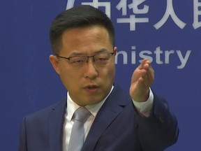 Chinese Foreign Ministry spokesperson Zhao Lijian responds during the daily media presser in Beijing, Friday, Nov. 19, 2021.