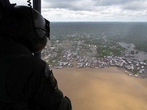 In this aerial view a Brazilian helicopter patrols an area of the municipality of Atalaia do Norte, state of Amazonas, Brazil on June 10, 2022.
